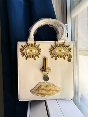 Schiaparelli Inspired cream woman’s Leather Face-Applique Tote Bag